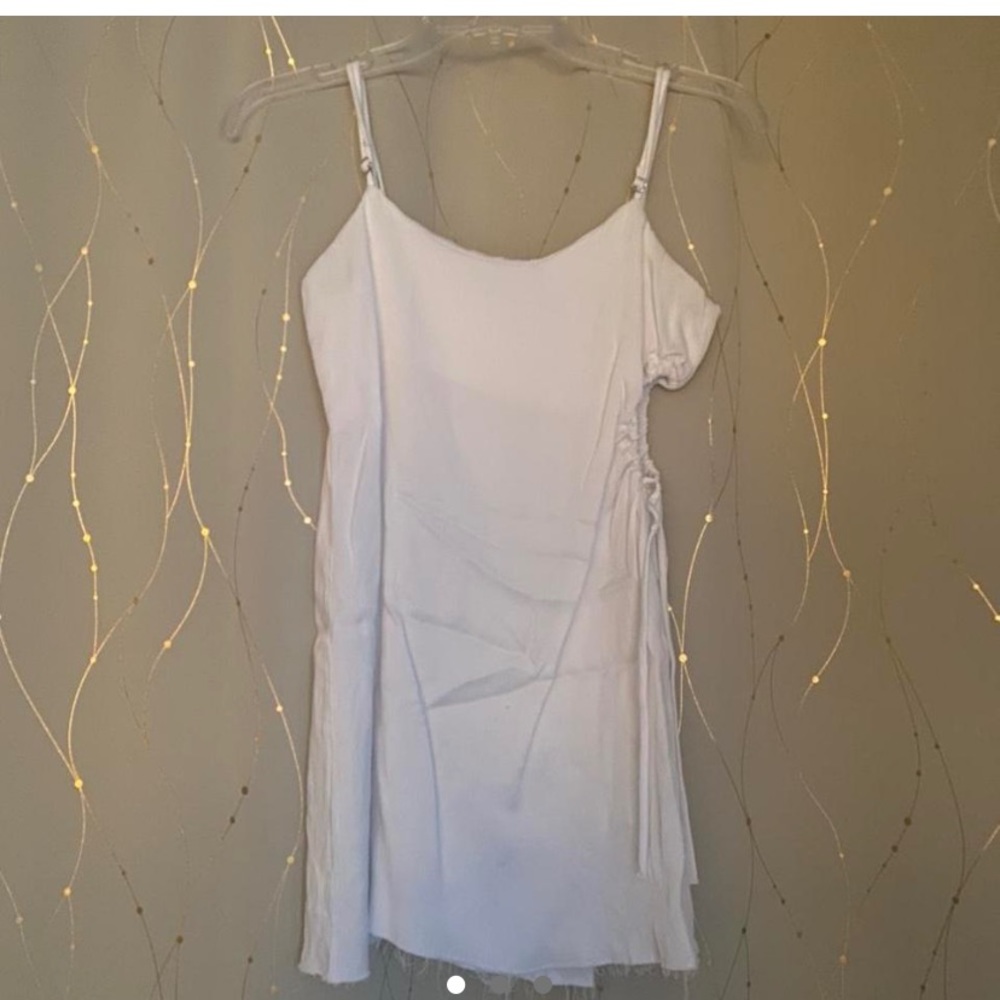 White mini dress from zara. Unique side asymmetric detail. No noticeable flaws.